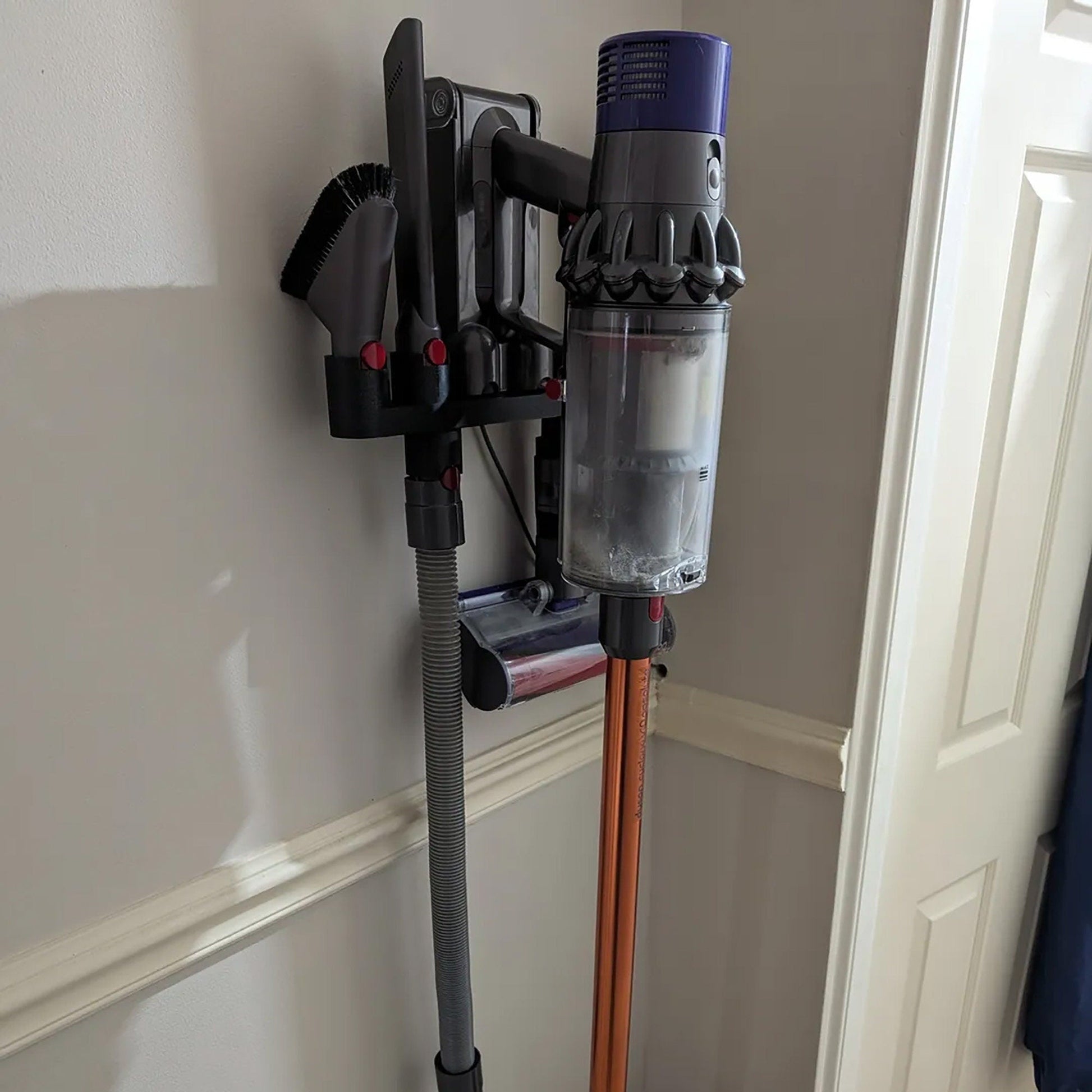 a vacuum is hooked up to a wall