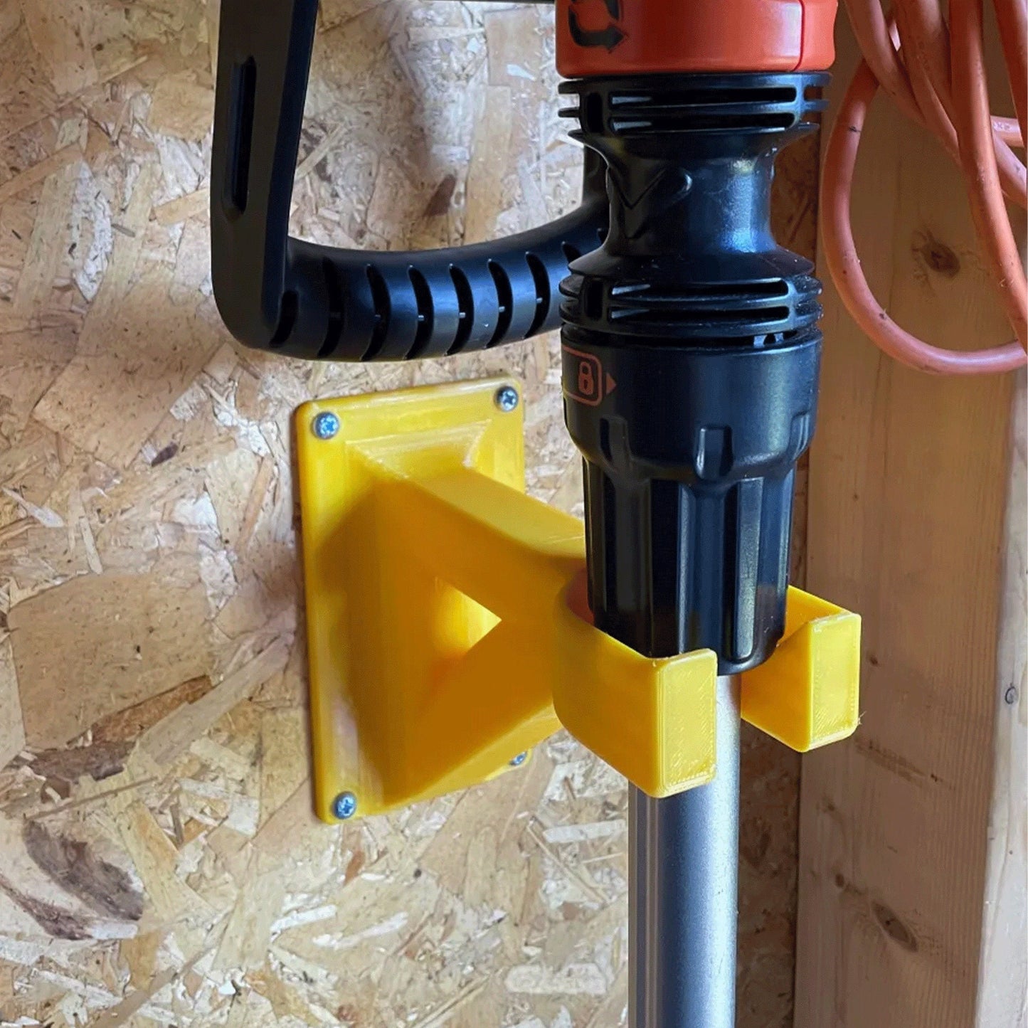 a close up of a drill on a piece of wood