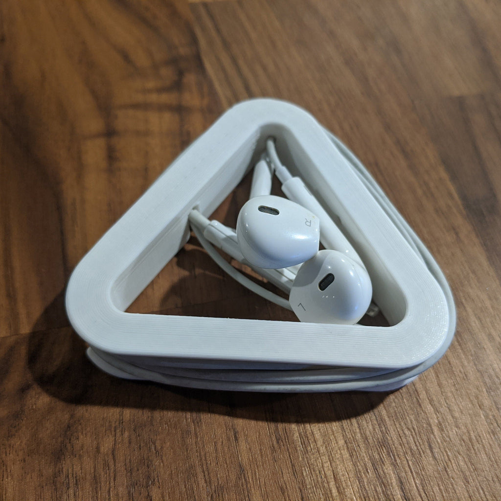 Triangular earphone cord wrap holding wired earbuds and cable tangle-free, view 6