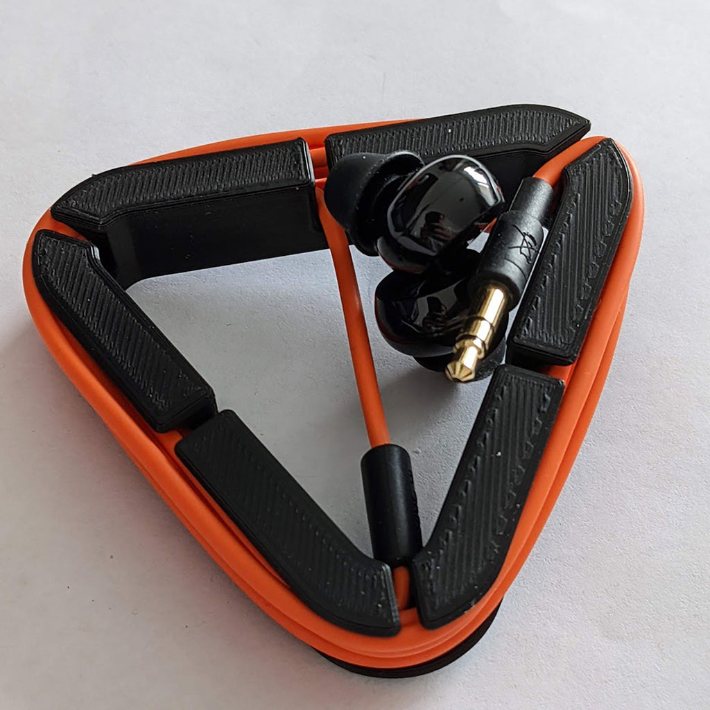 Triangular earphone cord wrap holding wired earbuds and cable tangle-free