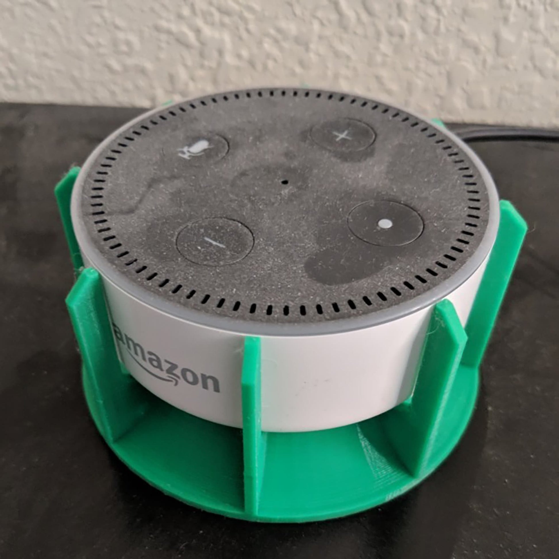 an amazon smart speaker sitting on top of a table