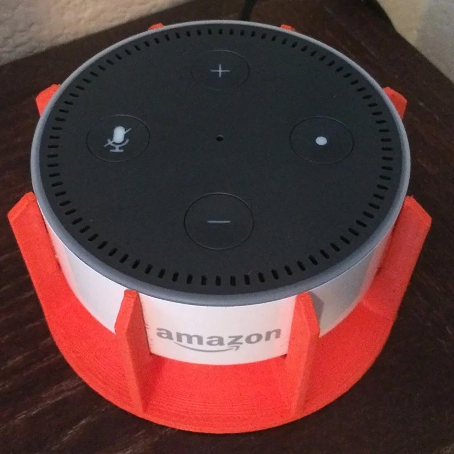 an amazon echo sitting on top of a table