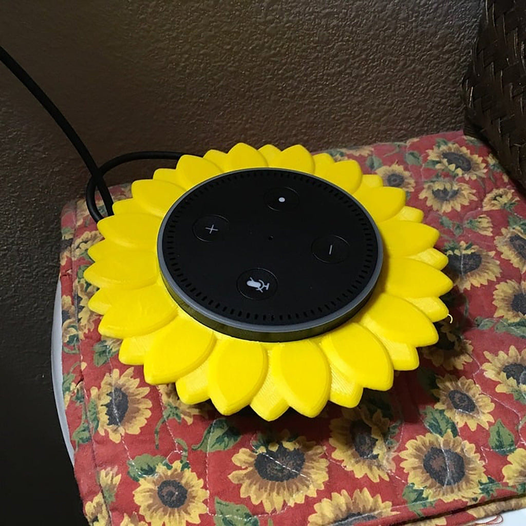 Sunflower stand with layered petals framing a puck-style Echo Dot speaker, view 6