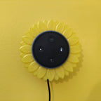 Sunflower stand with layered petals framing a puck-style Echo Dot speaker, view 7