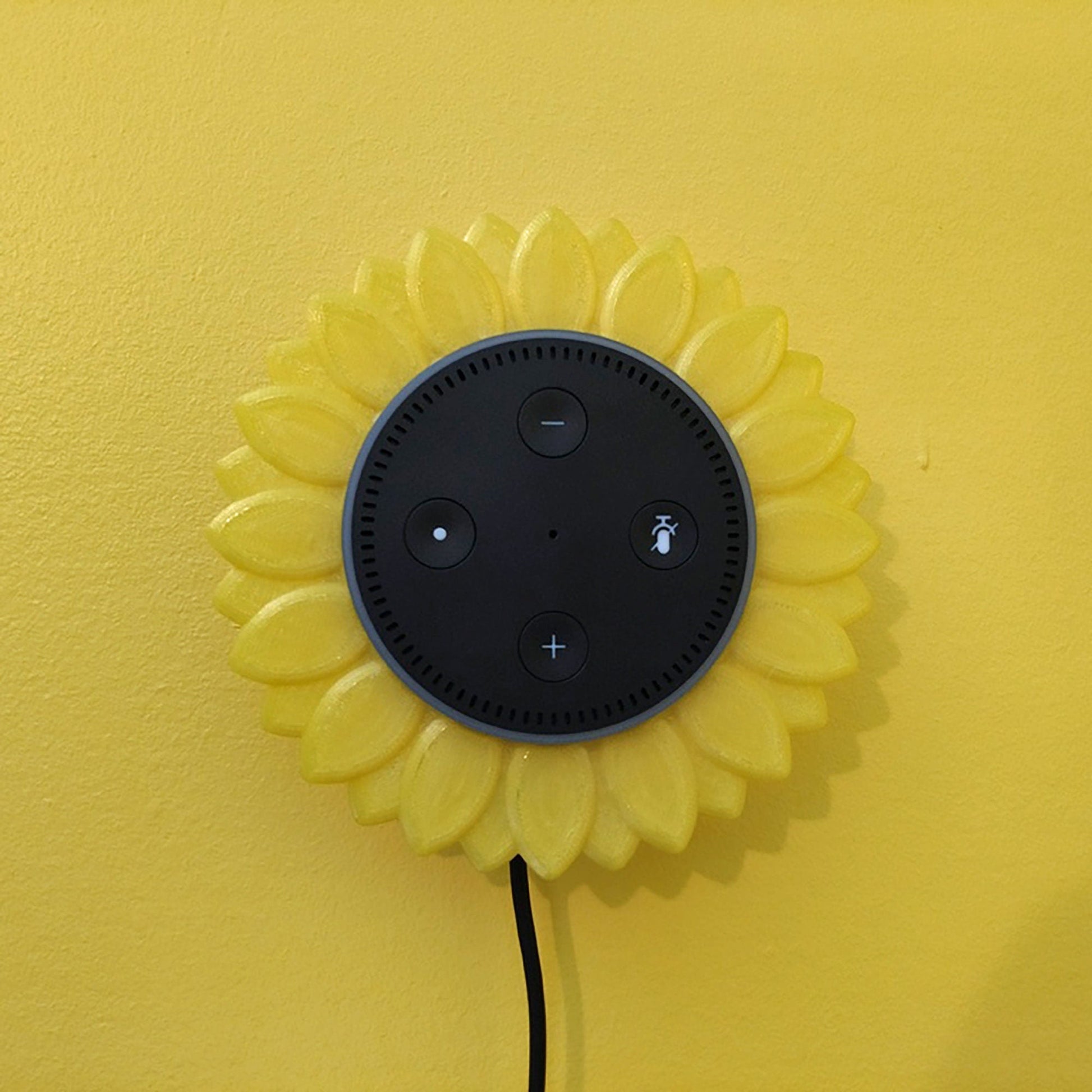 a black and yellow clock on a yellow wall