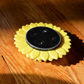 a yellow and black device sitting on a wooden floor