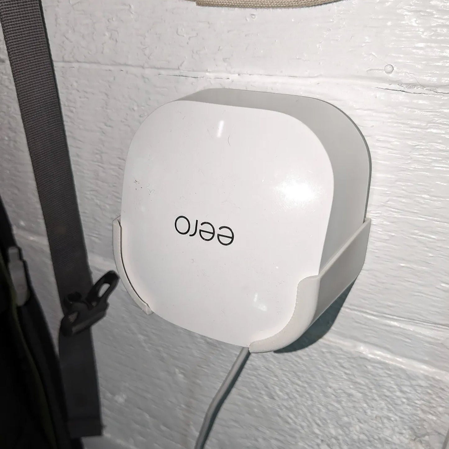 a close up of an electronic device attached to a wall