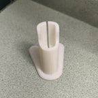 Charging stand holding a Philips OneBlade QP2520 razor upright, view 3