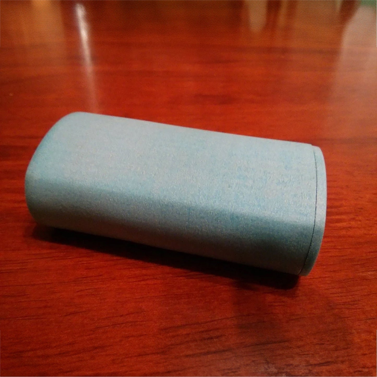 a blue case sitting on top of a wooden table