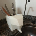 Geometric elephant utensil holder draining cutlery into the sink, view 2