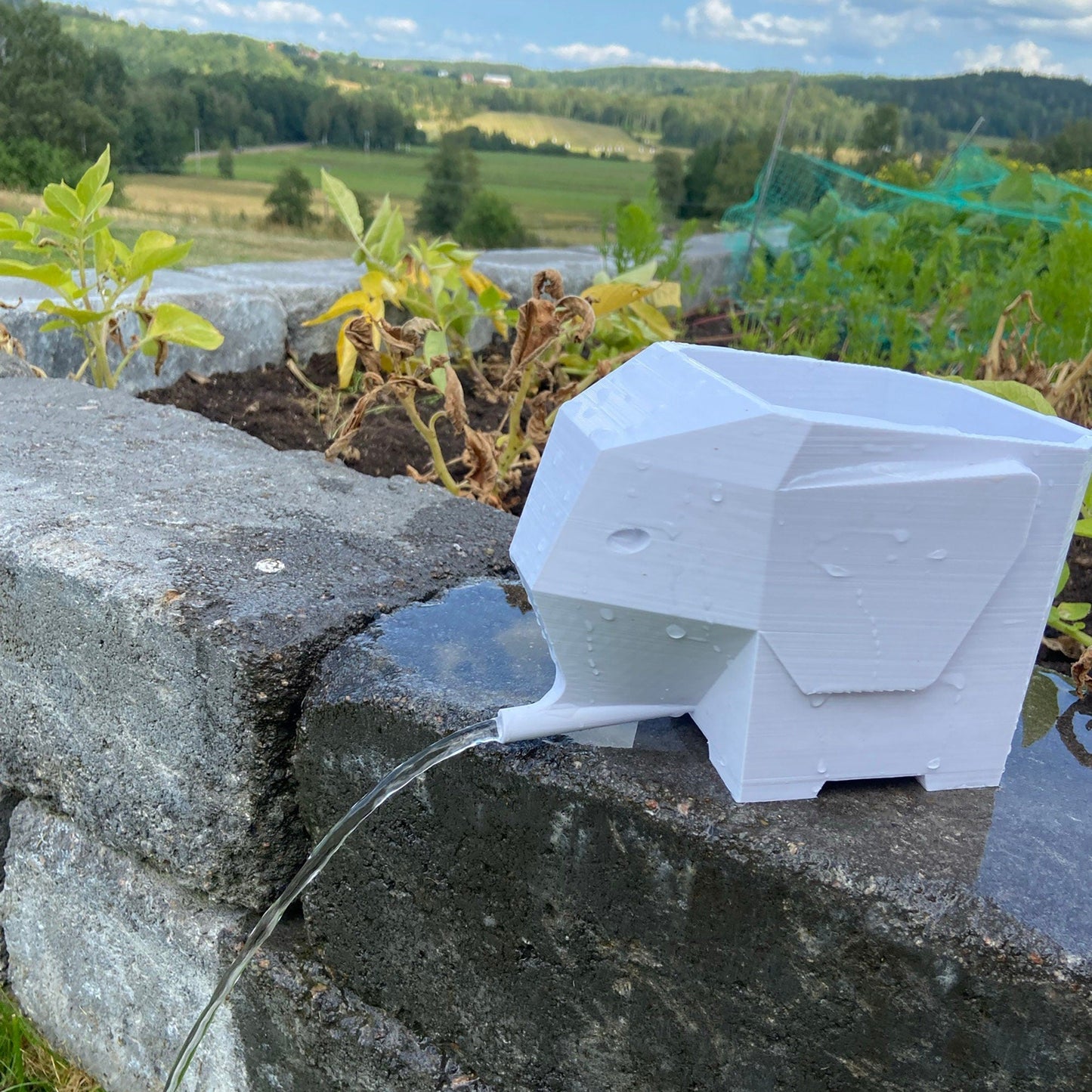 a white object sitting on top of a stone wall