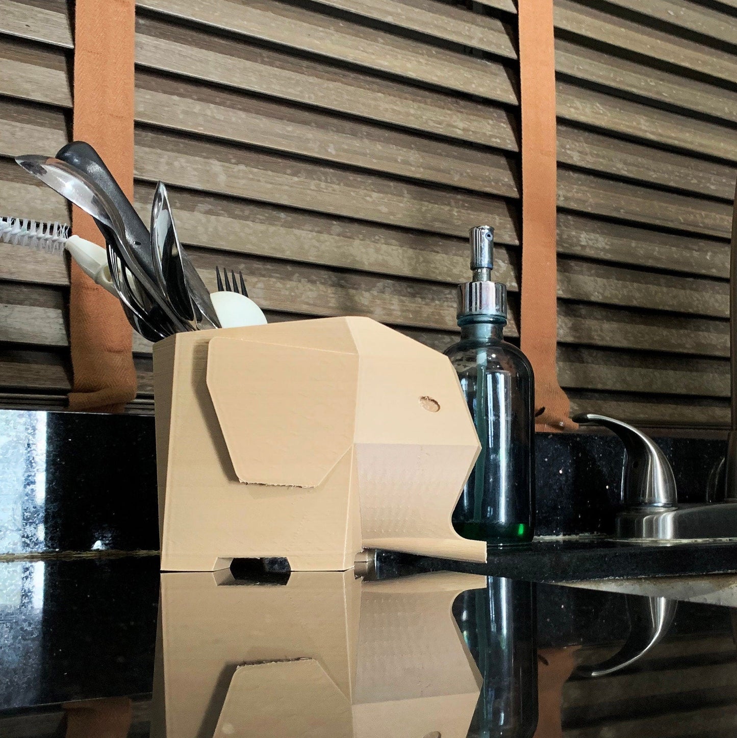 a kitchen counter with a sink and a counter top