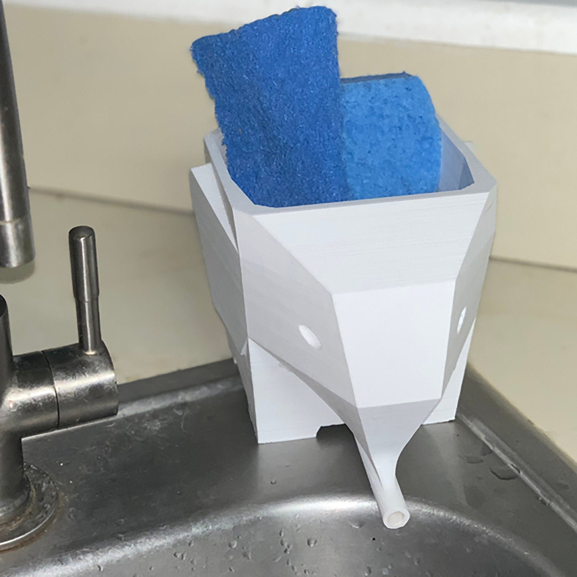 a sink with some blue towels in it