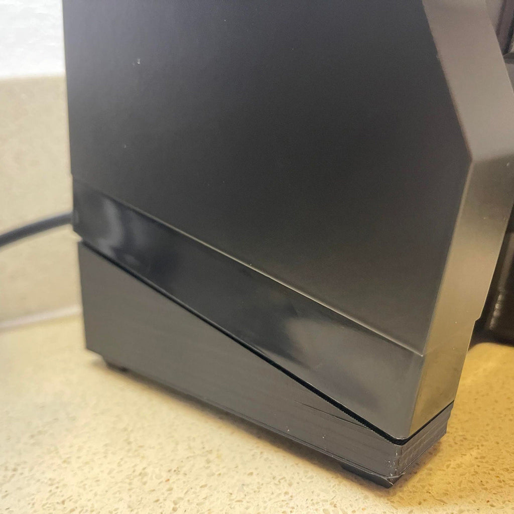 Tilting single dosing base with catch tray holding a Eureka Mignon Specialita at 15 degrees, view 4
