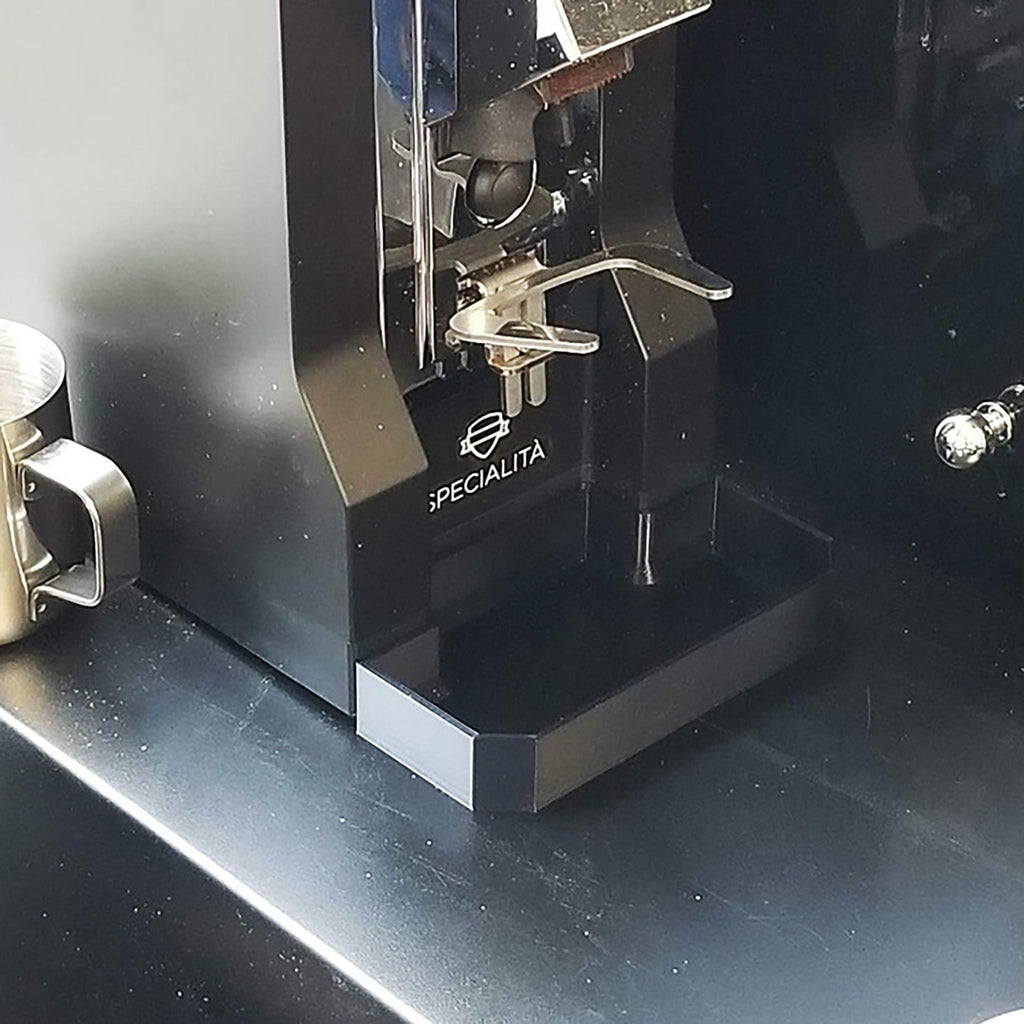 Deep drip tray sitting flush against the base of a Eureka Mignon Specialita grinder, view 2