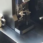 Deep drip tray sitting flush against the base of a Eureka Mignon Specialita grinder, view 2