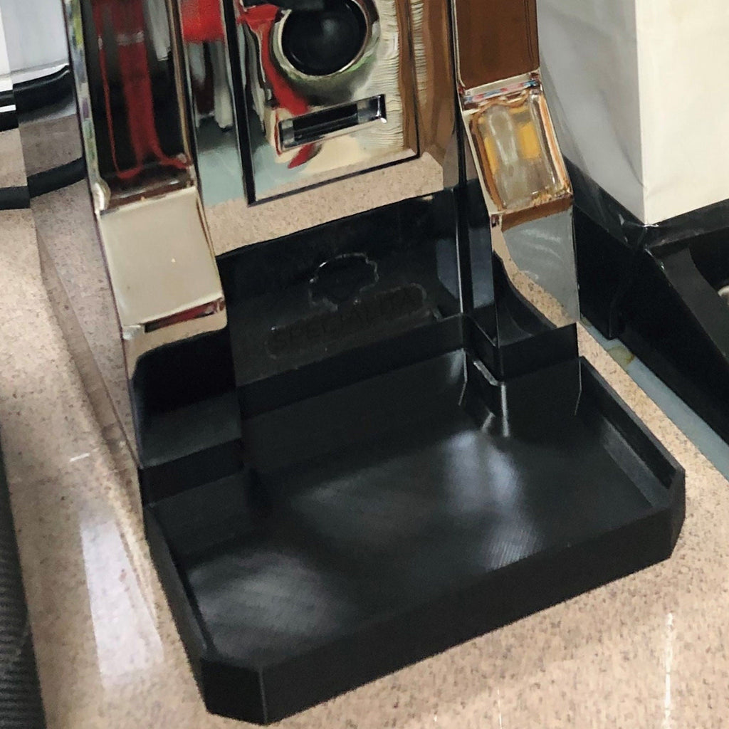 Deep drip tray sitting flush against the base of a Eureka Mignon Specialita grinder, view 4