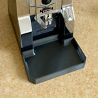 Deep drip tray sitting flush against the base of a Eureka Mignon Specialita grinder