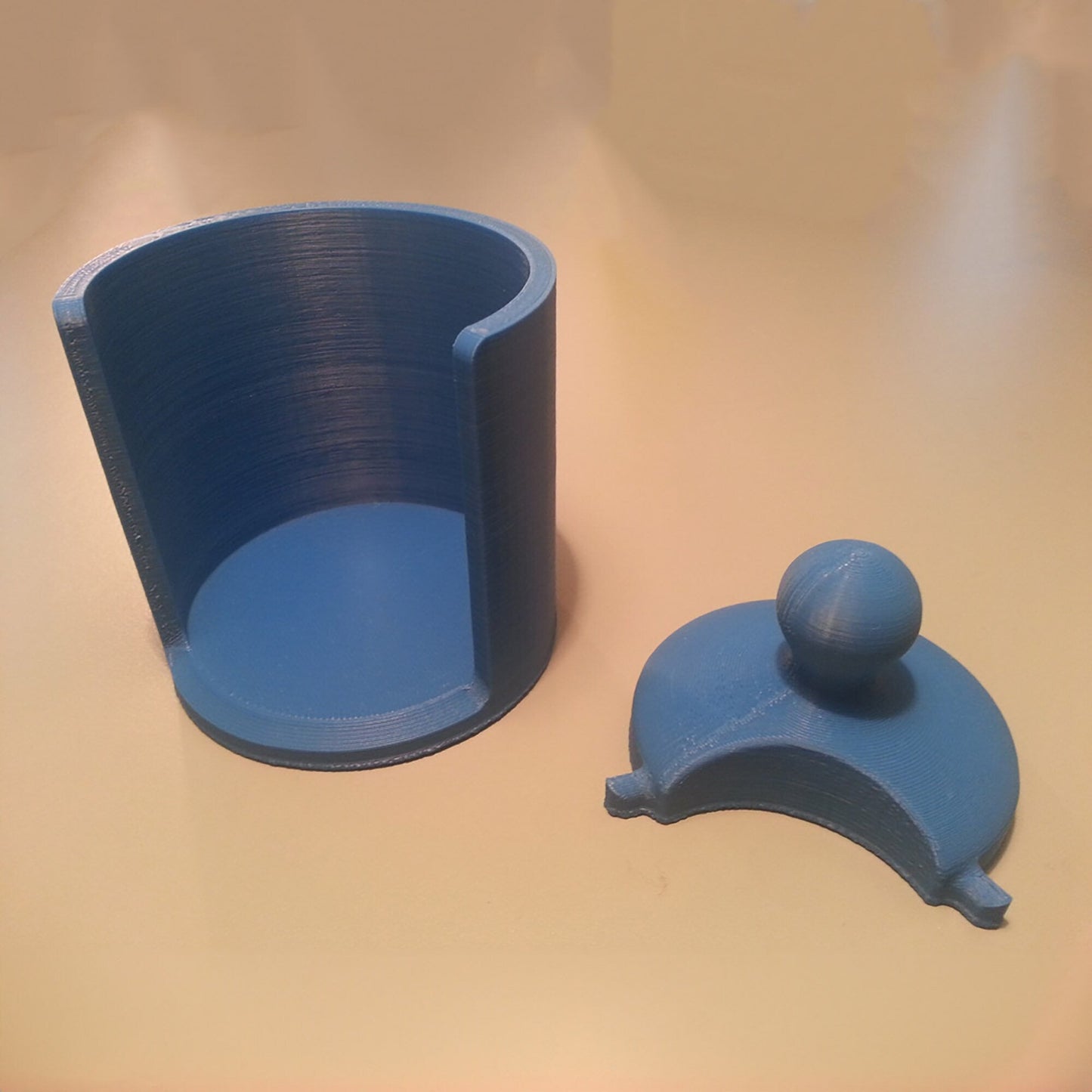 a blue cup sitting on top of a table