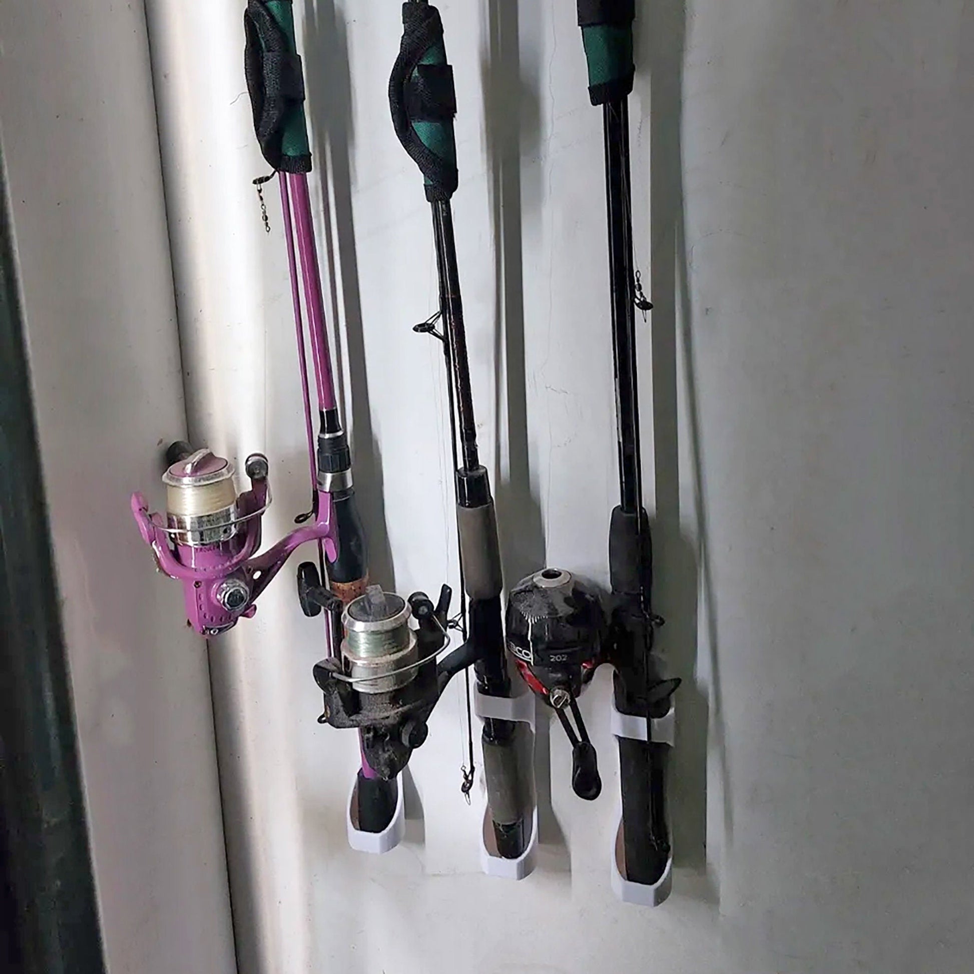 a couple of fishing rods hanging on a wall