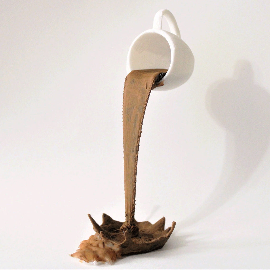 Floating coffee mug sculpture with a coffee stream pouring into a splash puddle, view 4