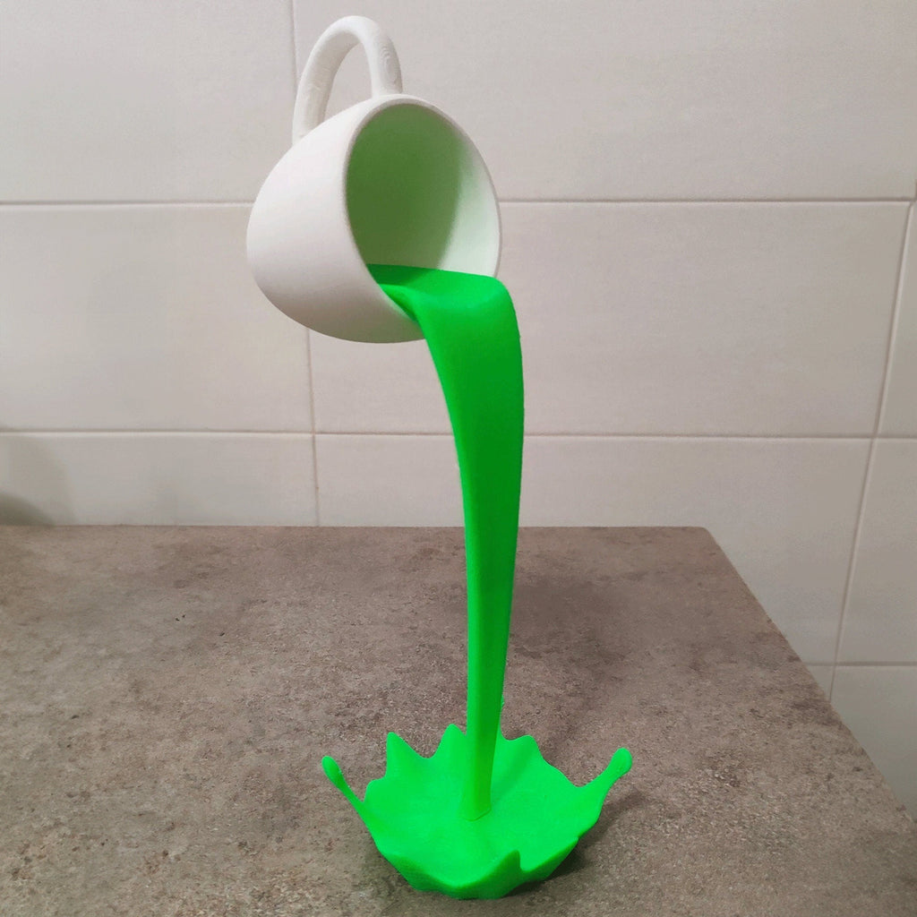 Floating coffee mug sculpture with a coffee stream pouring into a splash puddle, view 5