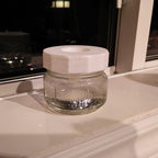 Fruit fly trap lid with inverted cone on a mason jar, view 4