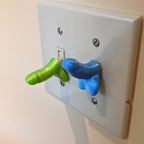 Novelty adult gag toggle caps for standard 15A and 20A light switches