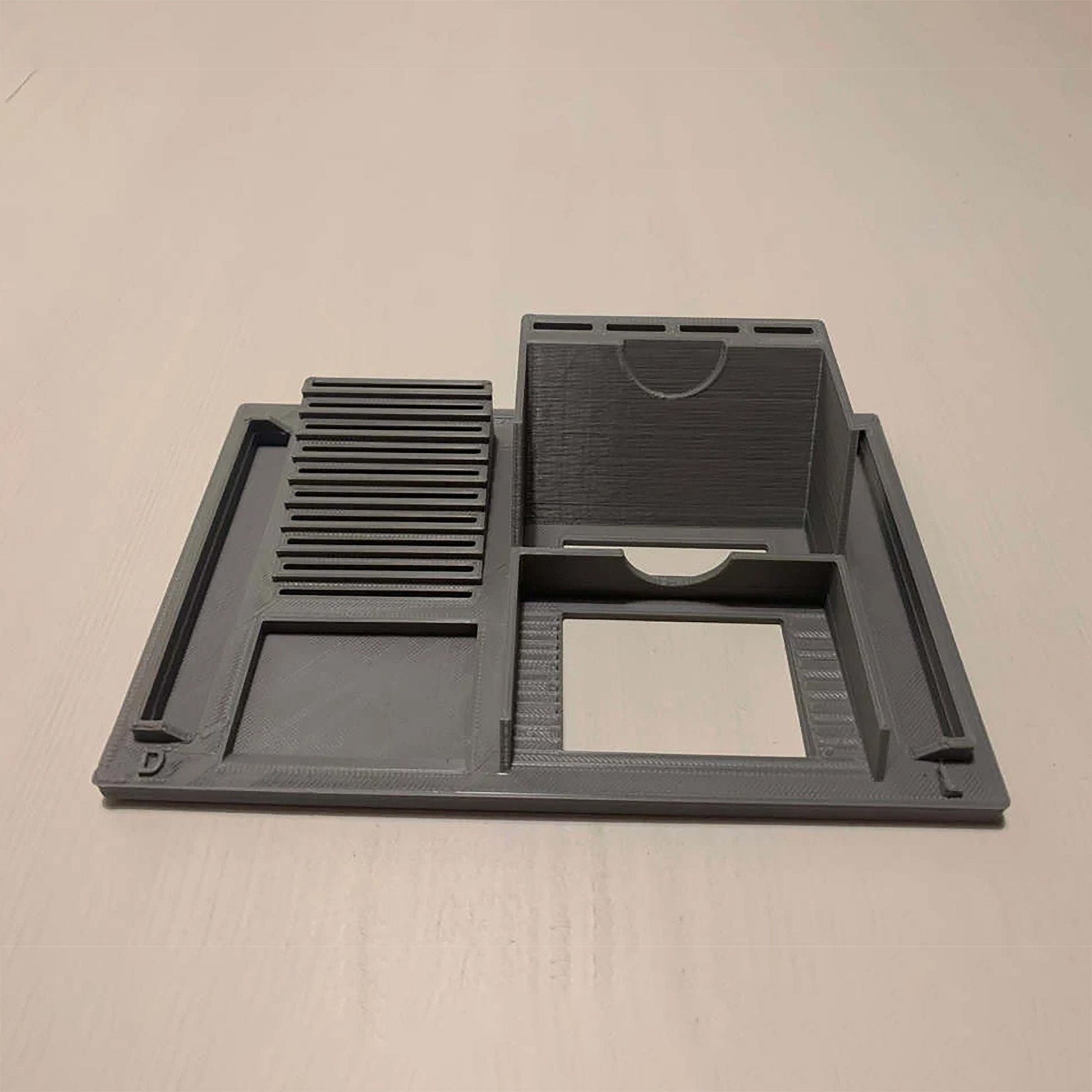 a black tray with a mirror on top of it