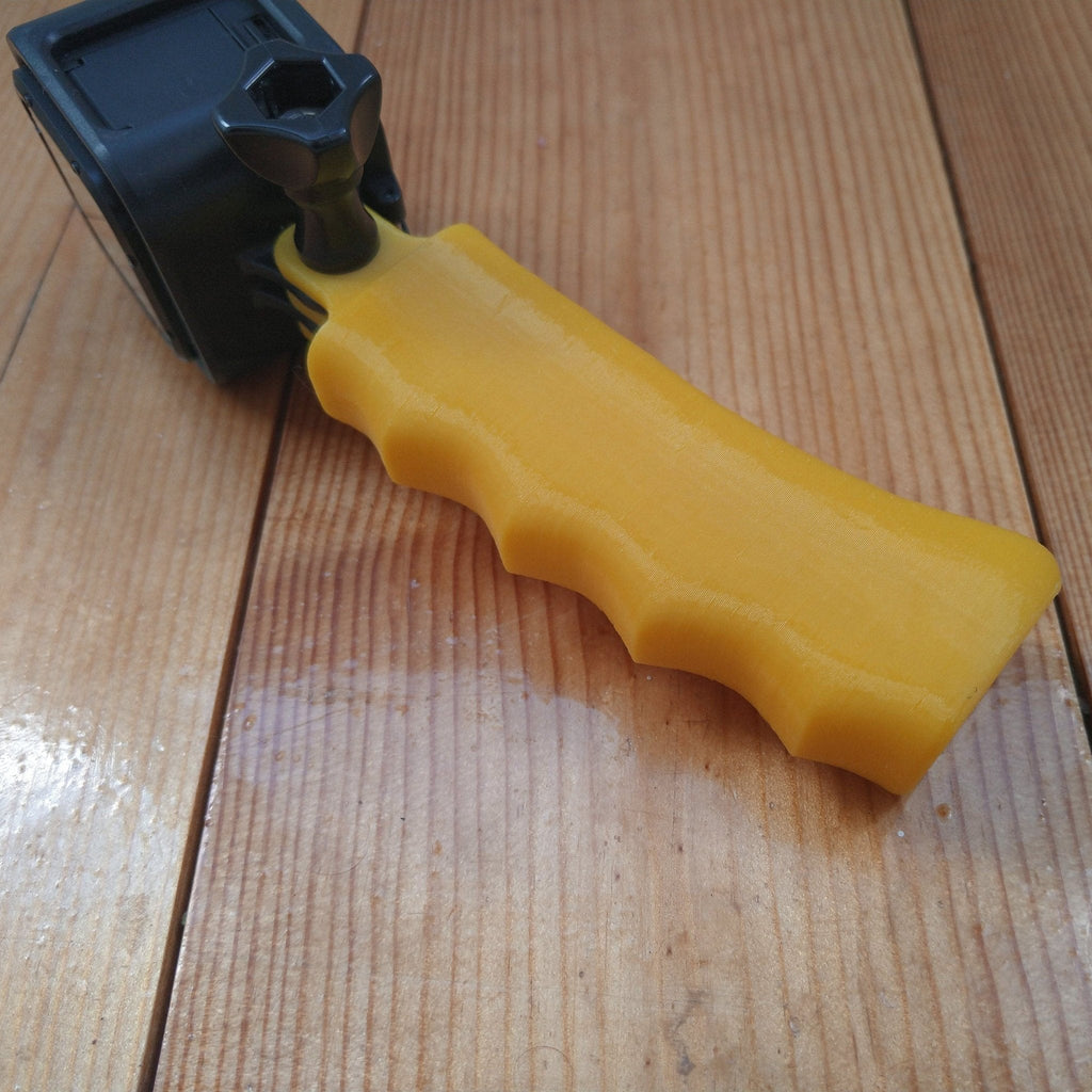 Pistol grip handle with finger grooves for GoPro action cameras