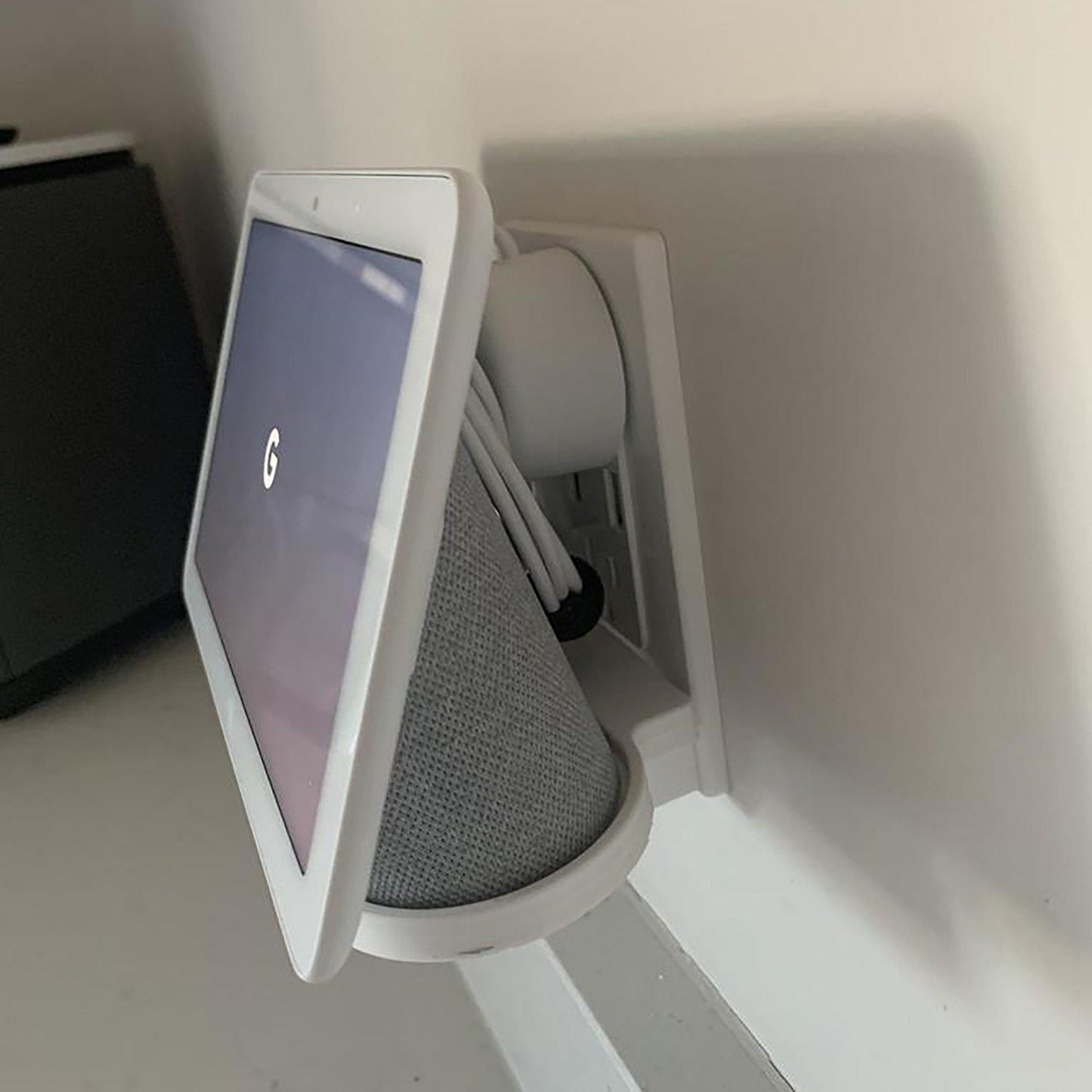 a computer monitor sitting on top of a white shelf