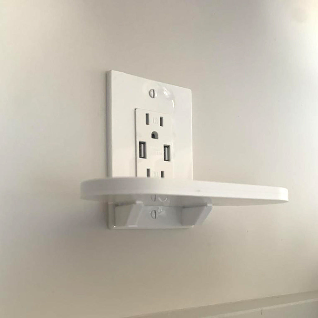 Outlet shelf holding a Google Nest Hub over a wall outlet