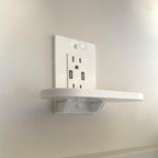 Outlet shelf holding a Google Nest Hub over a wall outlet