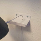 Wall mount bracket holding a Google Nest Hub smart display, view 2