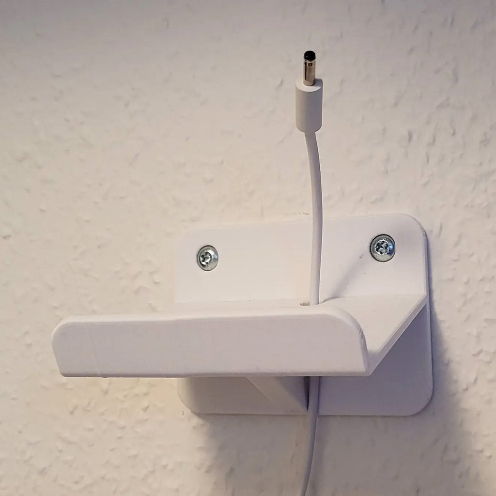 Wall mount bracket holding a Google Nest Hub smart display, view 3