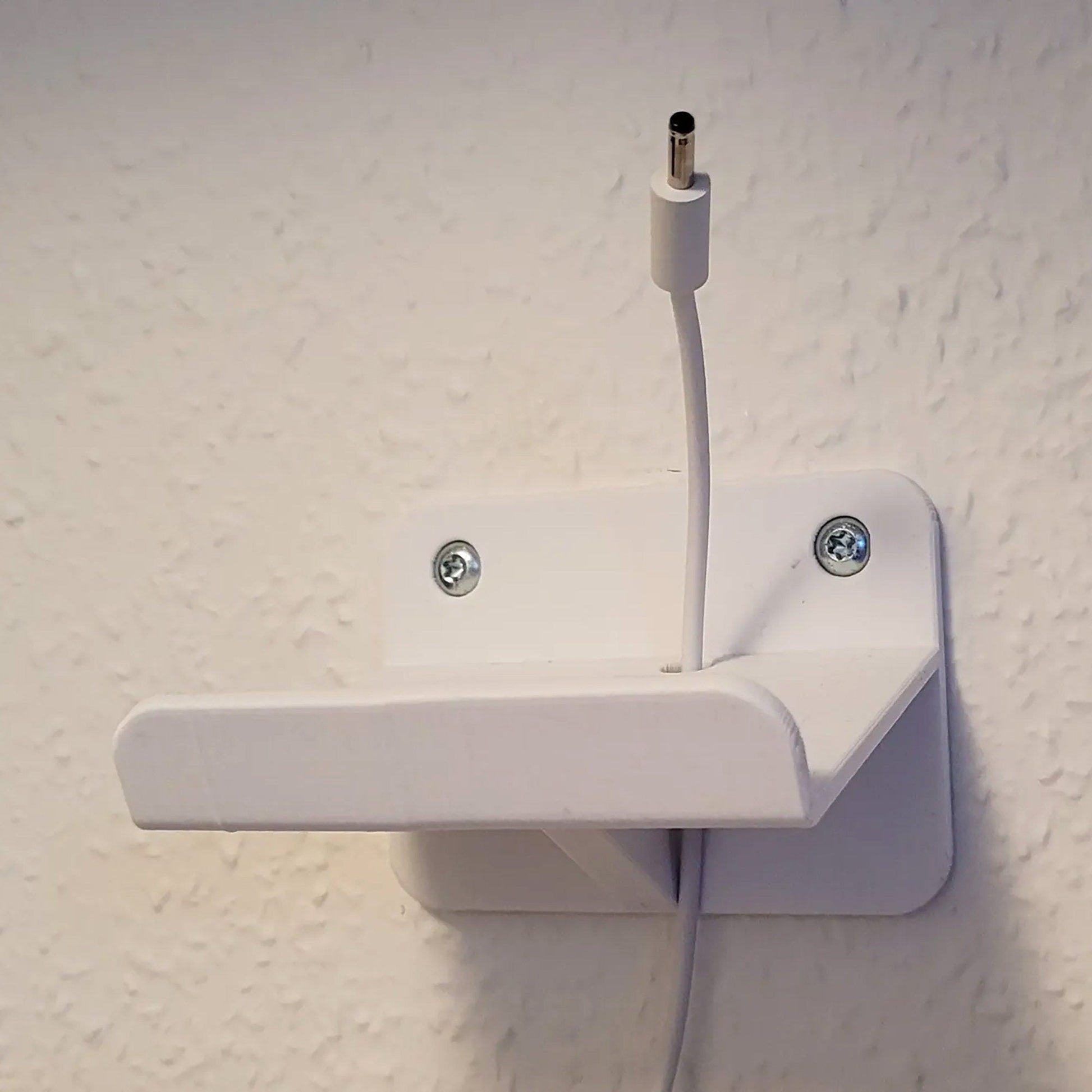 a white electrical outlet attached to a wall