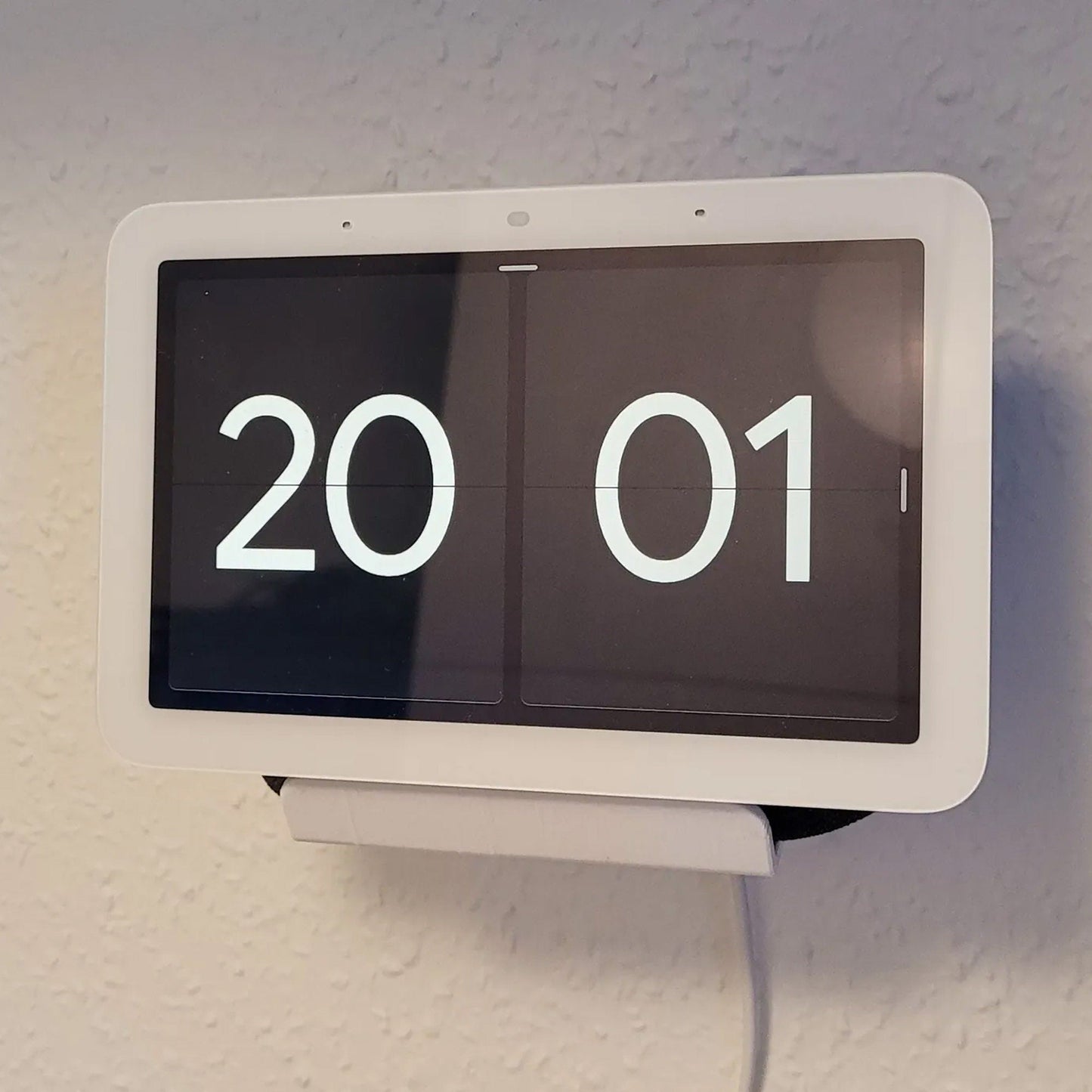 a digital clock displaying the time on a wall