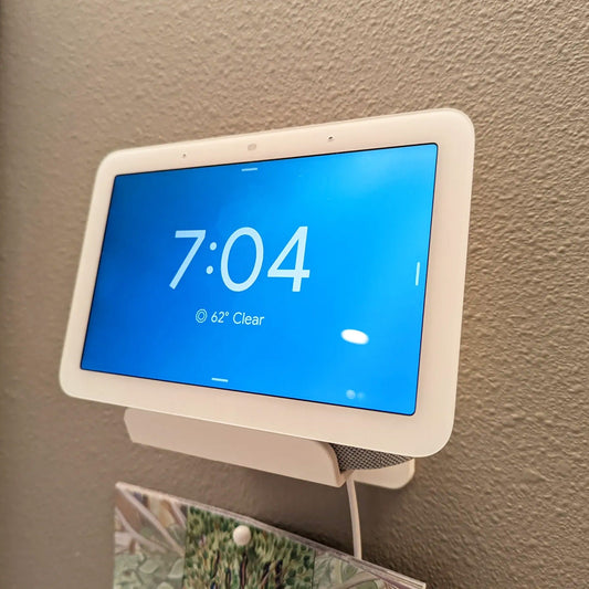 a white and blue clock mounted to a wall