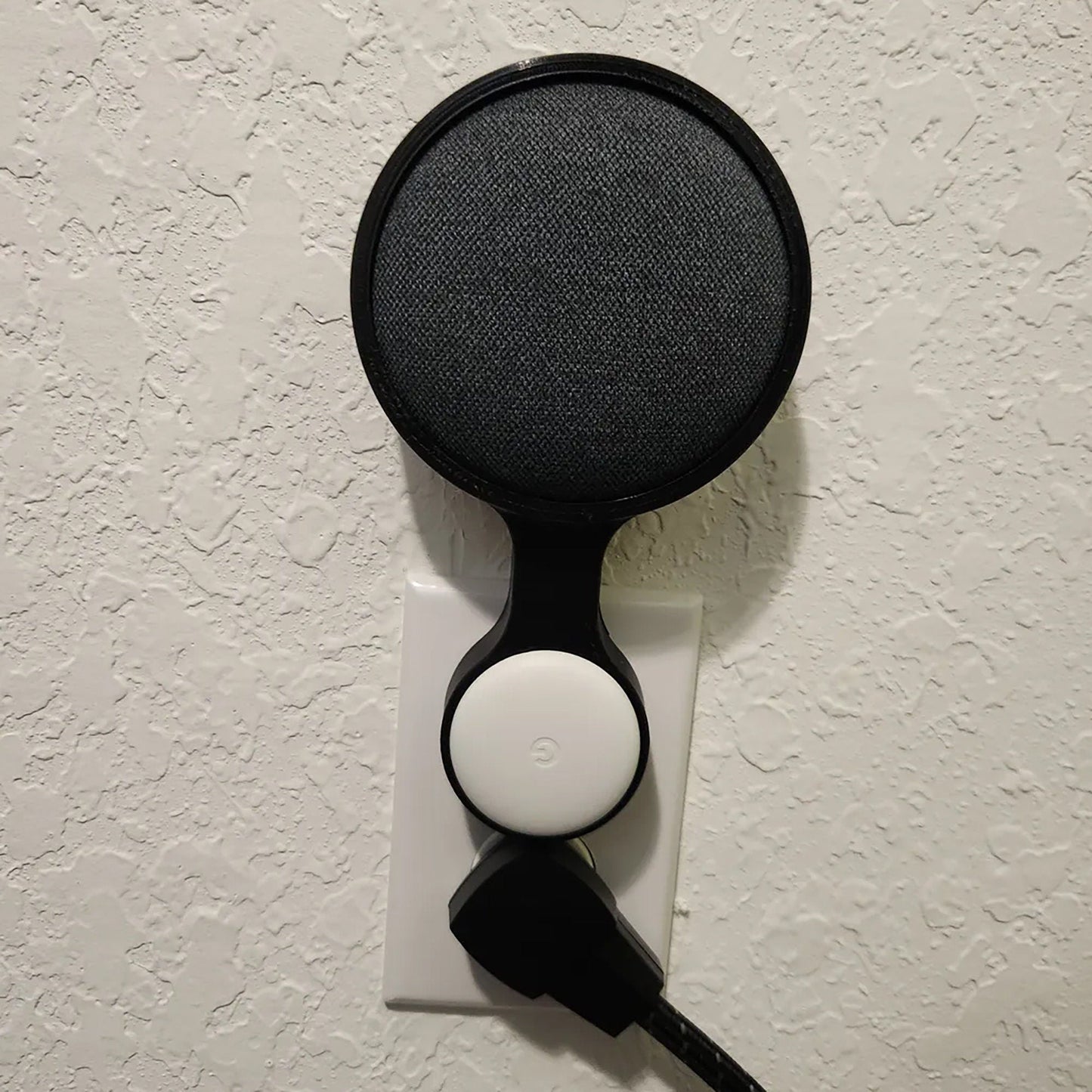 a close up of a hair dryer on a wall