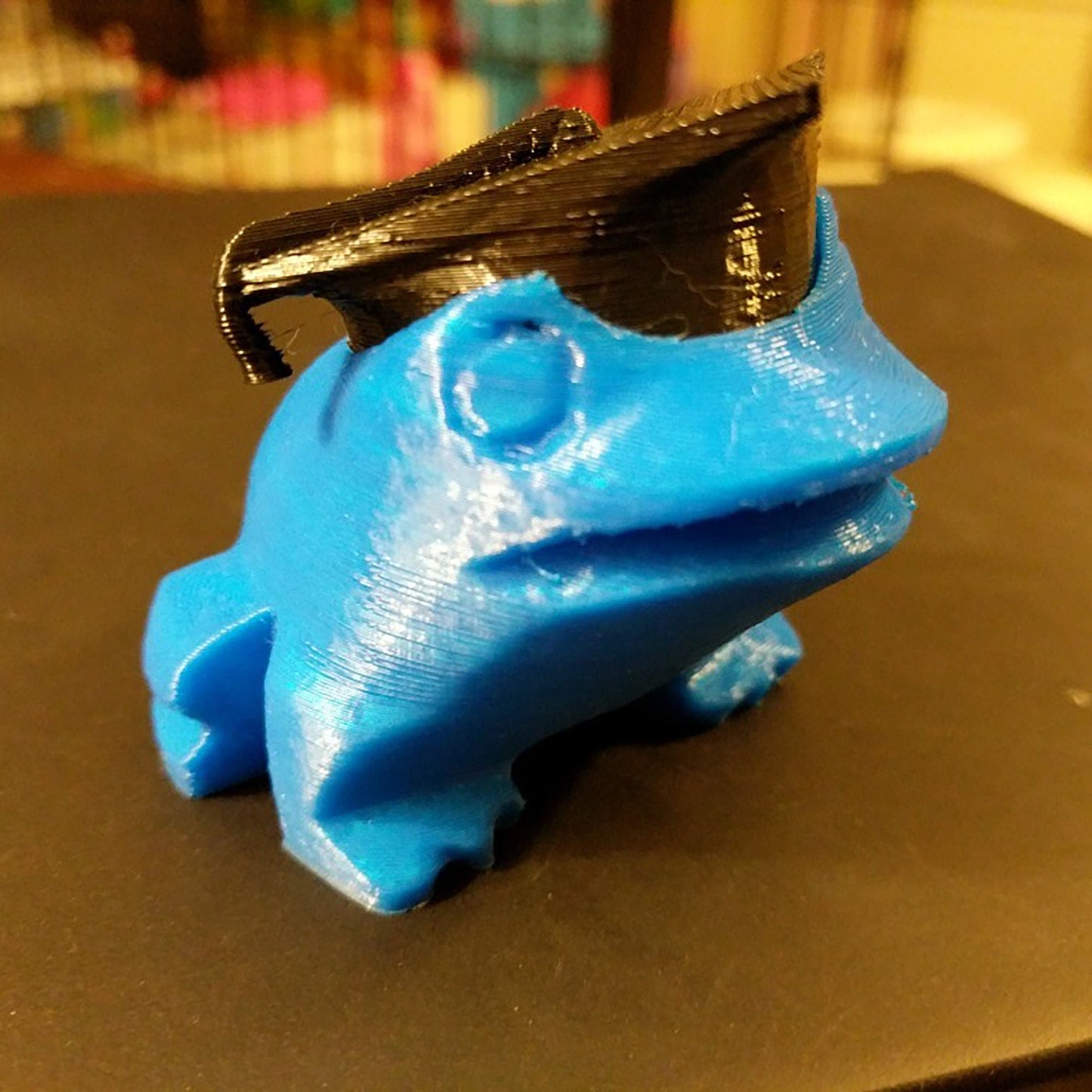 a blue plastic object sitting on top of a table