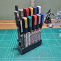 a group of pens sitting on top of a table