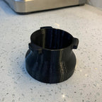 Dosing funnel on a 54mm portafilter basket for Breville Barista espresso machines, view 2