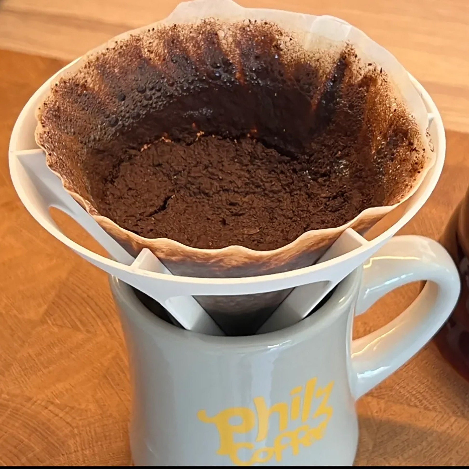 a cup of coffee with a cake inside of it