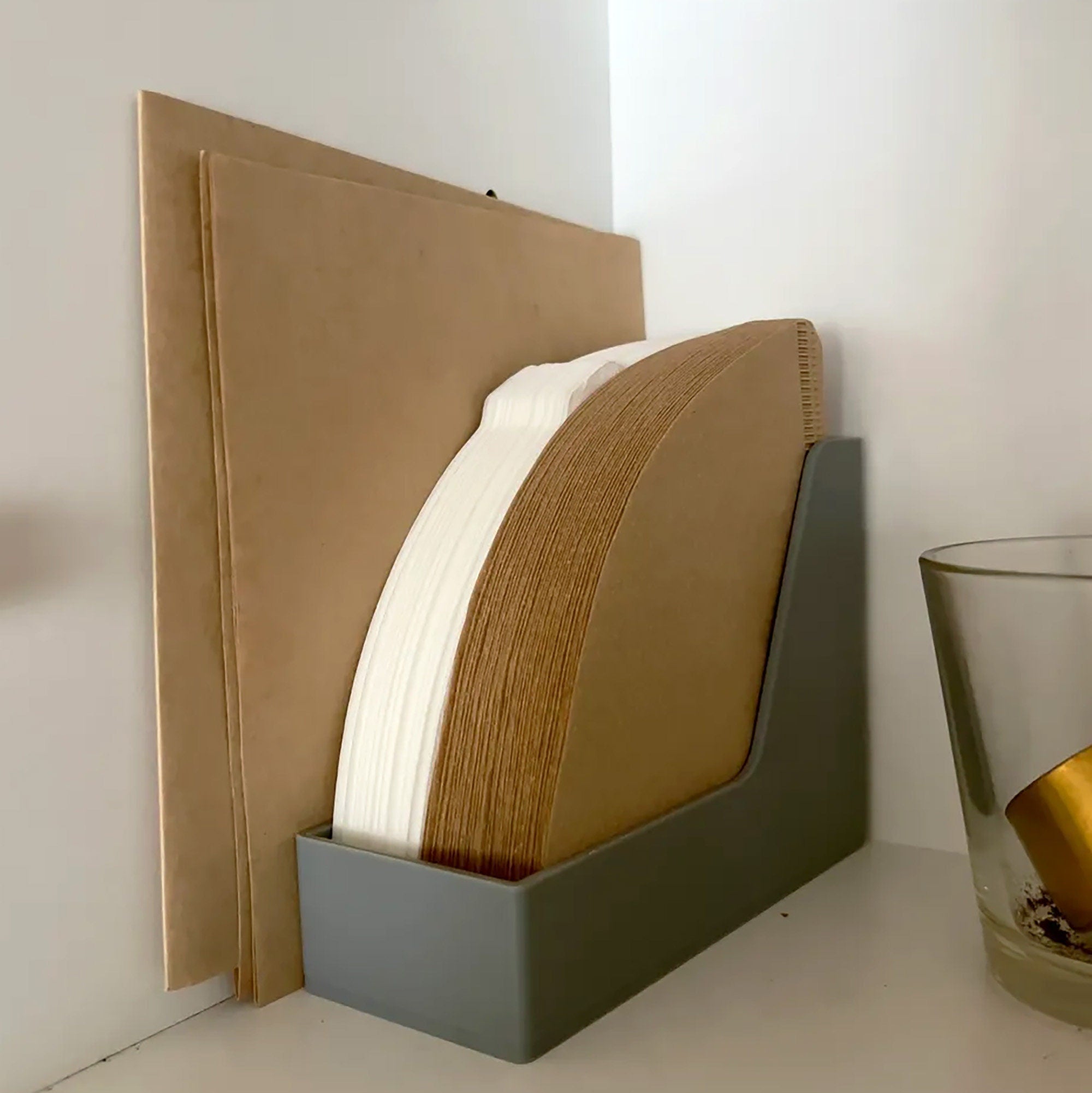 a close up of a book and a glass on a table