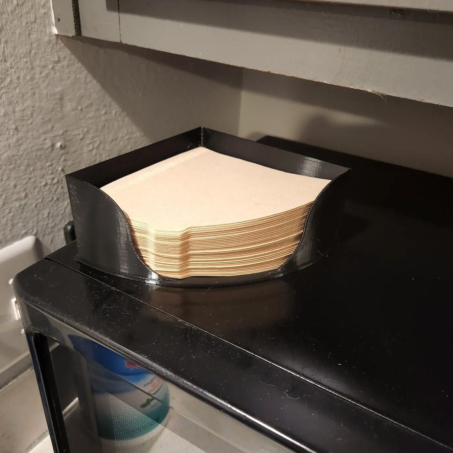 a stack of paper sitting on top of a black counter