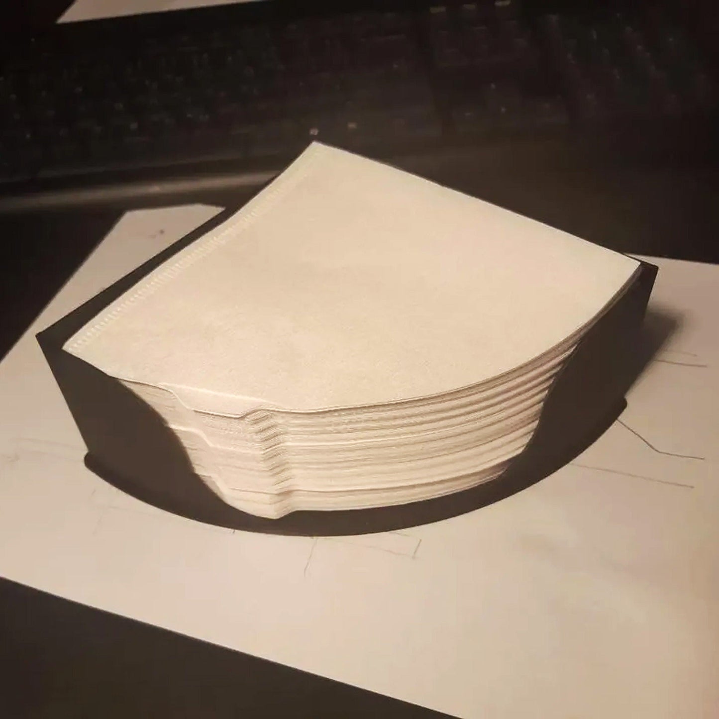 a stack of white paper sitting on top of a table