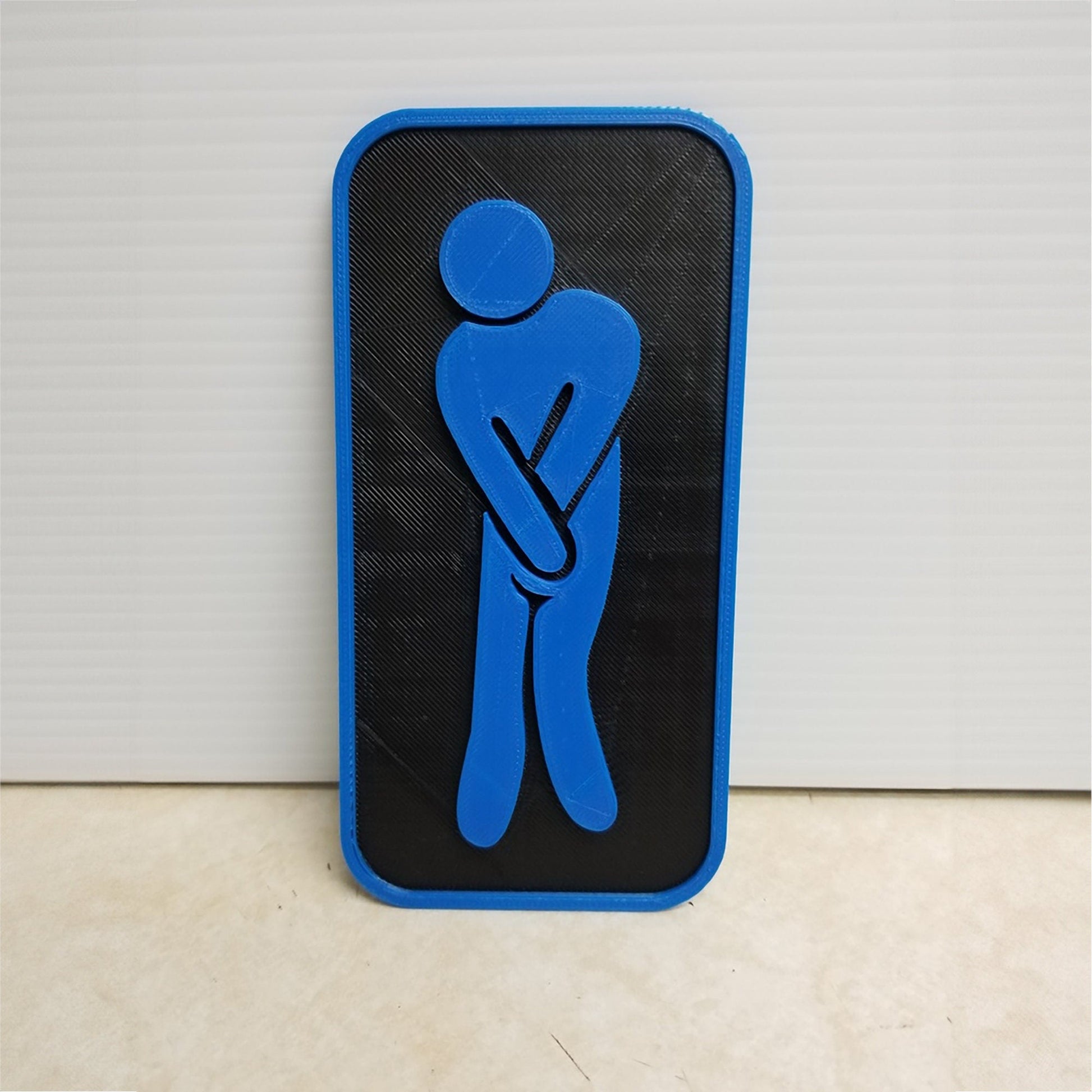 a blue and black sign with a person holding a cane