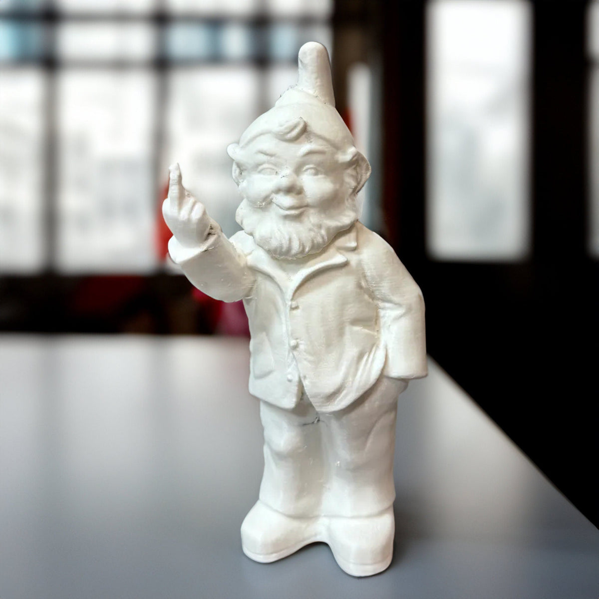Middle finger garden gnome with pointed hat and beard raising one finger