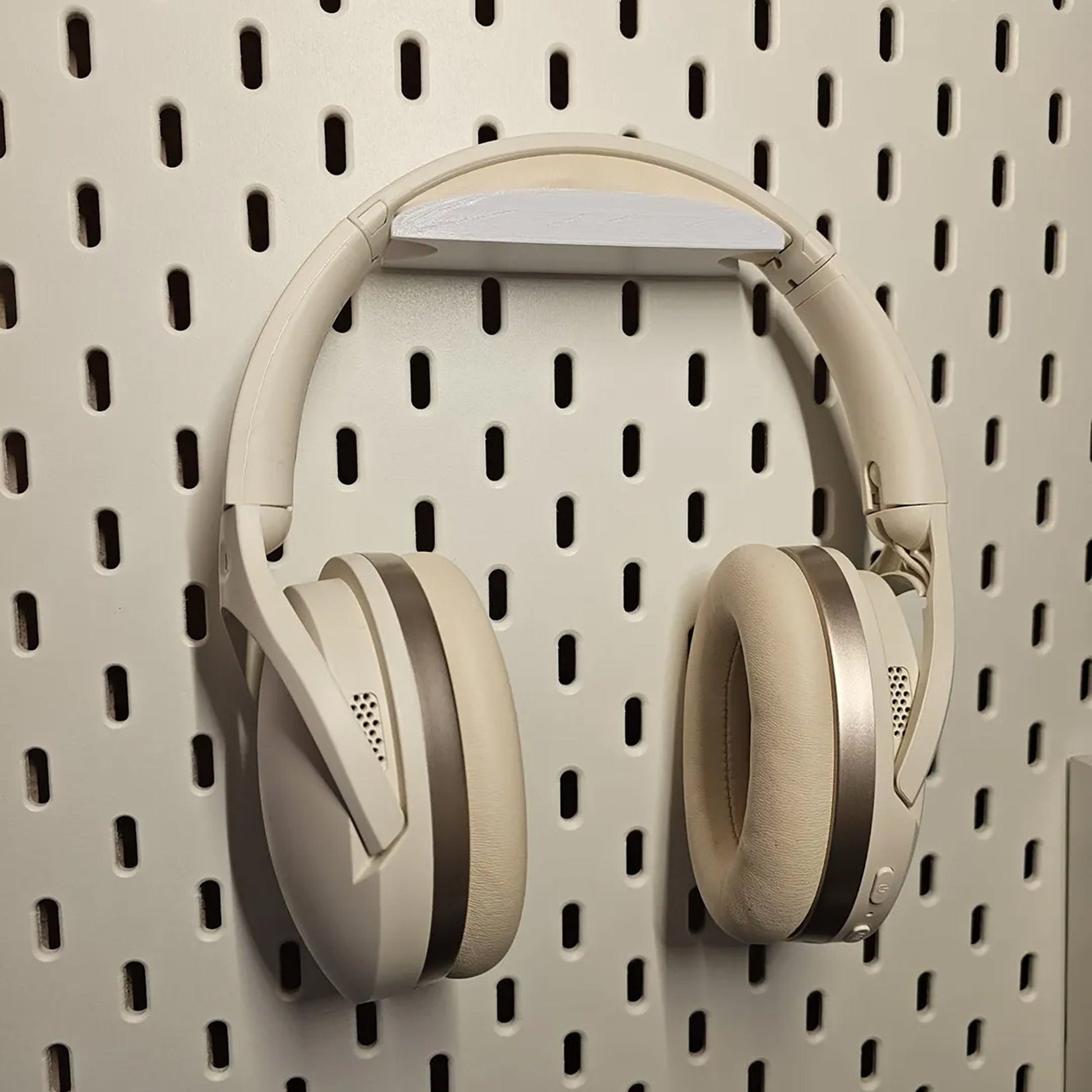 a pair of headphones hanging on a wall