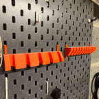 Screwdriver holder for IKEA SKADIS pegboard with angled slots holding drivers handle up, view 2